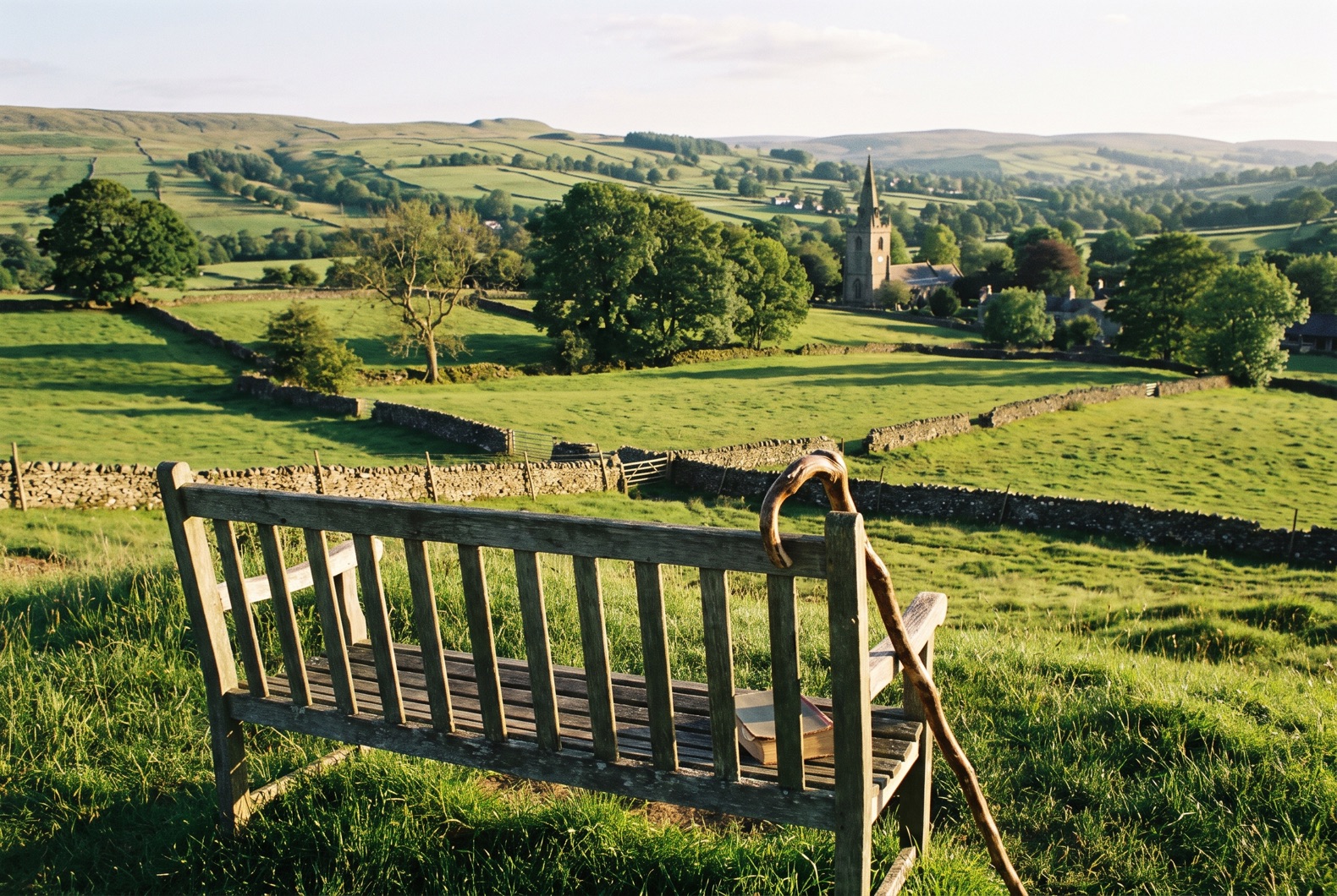 View from a garden bench looking out over quiet English countryside